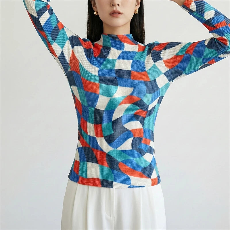 Person wearing a colorful geometric patterned sweater on a white background