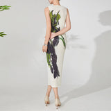 Woman wearing a sleeveless dress with floral pattern on a white background