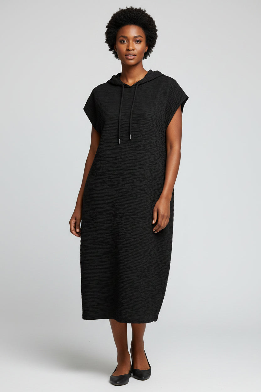 Black sleeveless dress on a hanger against a neutral background