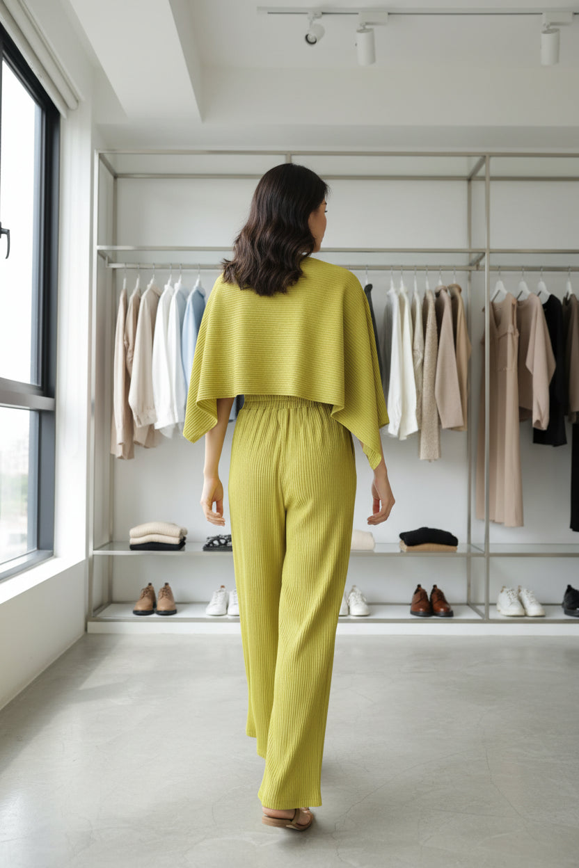 Green outfit on a mannequin against a white background