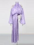 Lavender dress on a mannequin against a white background