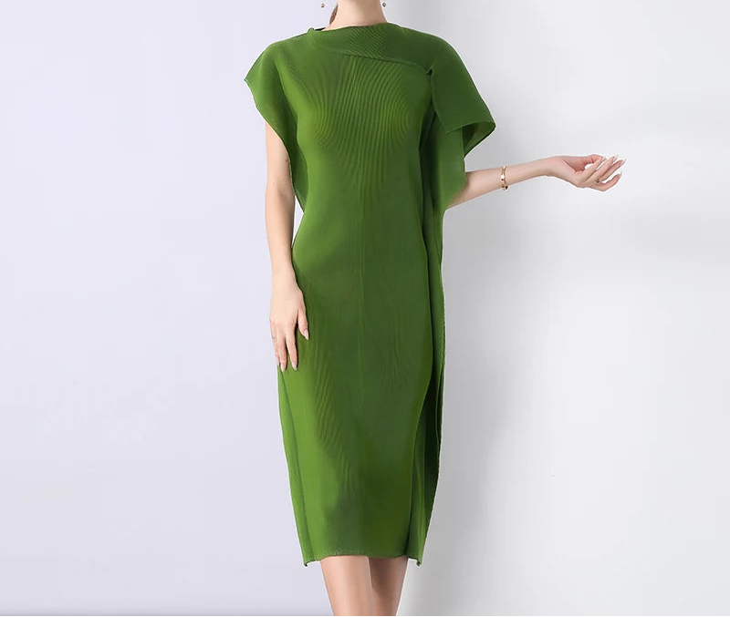 Green dress worn by a model on a white background