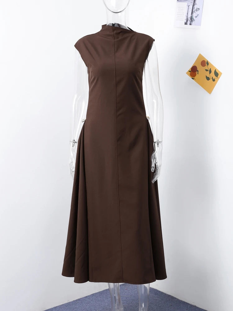 Brown dress on a mannequin against a white background