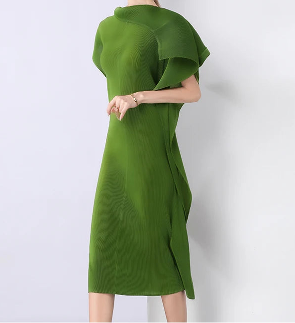 Woman wearing a green dress against a white background