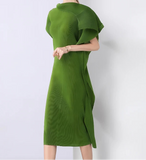 Woman wearing a green dress against a white background