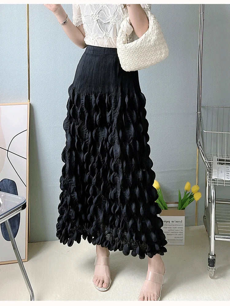 Person wearing a black textured skirt in an indoor setting