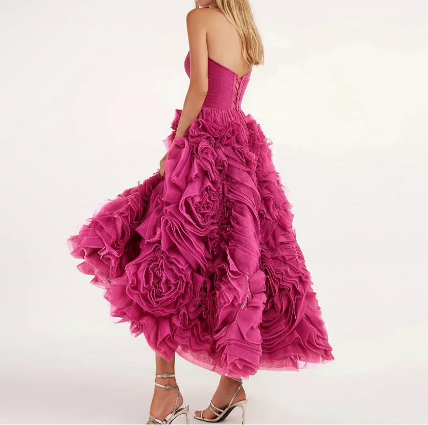 Pink ruffled dress on a white background with 'yipeisha' branding.