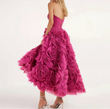 Pink ruffled dress on a white background with 'yipeisha' branding.