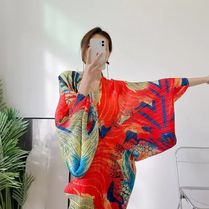 Person wearing a colorful kimono-style garment taking a mirror selfie.