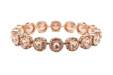 Necklace with pink gemstones against a blurred background