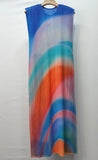 Colorful pleated dress on a hanger against a white background