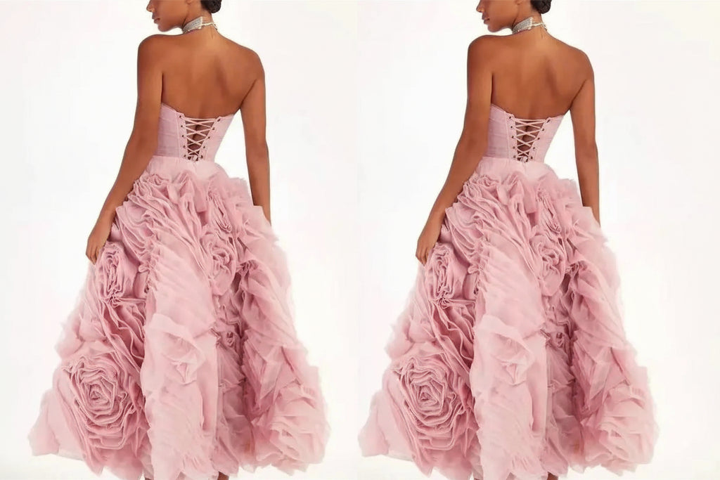 Pink strapless gown with floral details on a white background