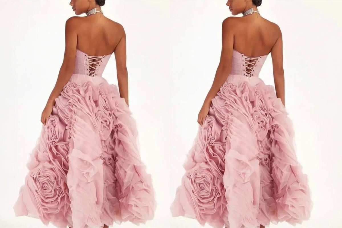 Pink strapless gown with floral details on a white background
