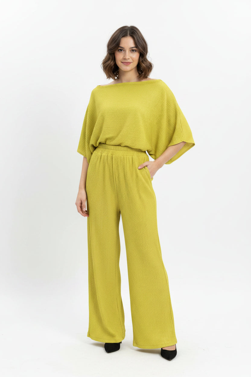 Yellow outfit on a mannequin against a white background