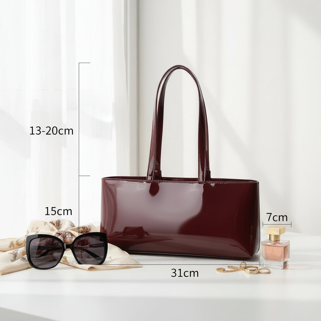 Burgundy handbag with dimensions indicated on a white background