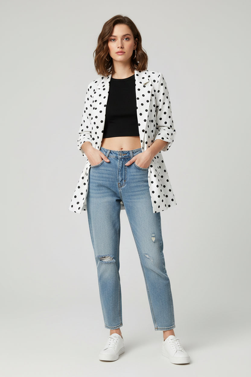 White shirt with black polka dot pattern on a gray background