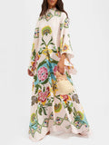 Woman wearing a colorful floral dress on a white background