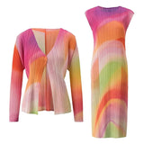 Colorful pleated top and dress set on a white background