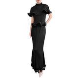 Black ruffled dress on a white background