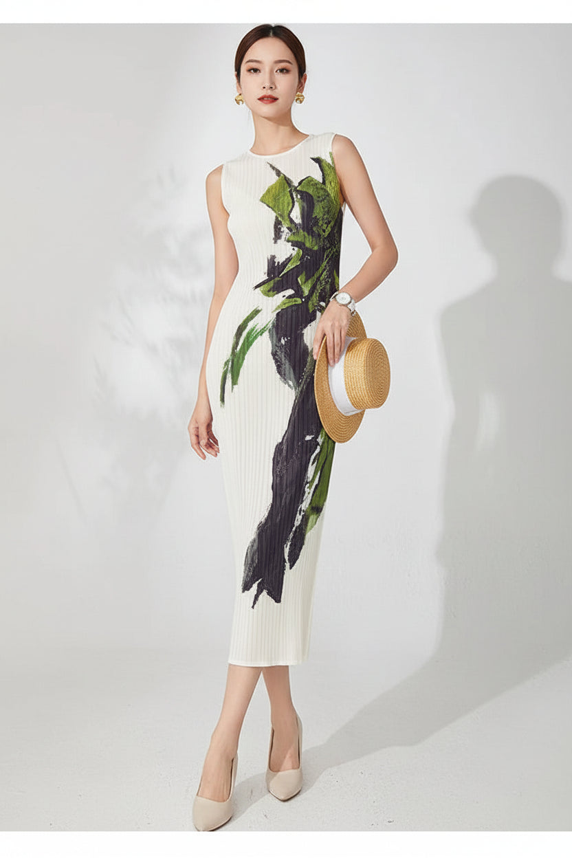 Woman wearing a white dress with green and black floral pattern on a plain background
