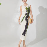 Woman wearing a floral dress with a plain background