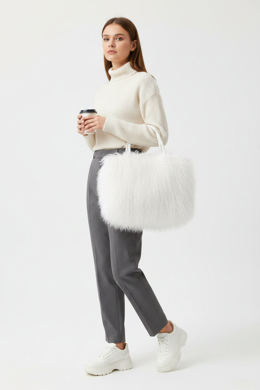 White fluffy handbag on a light gray background