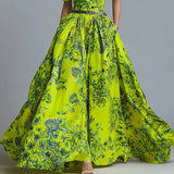 Neon green floral dress on a gray background
