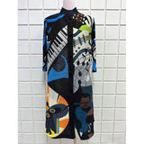 Colorful patterned shirt on a mannequin against a tiled wall