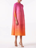 Woman wearing a gradient dress from orange to pink on a white background