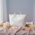 Clear tote bag with 'Cote' branding on a white background