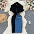 Black top and blue denim skirt on a hanger with decorative items around