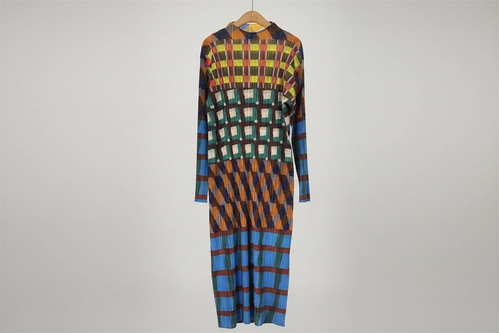 Colorful checkered dress on a hanger against a neutral background