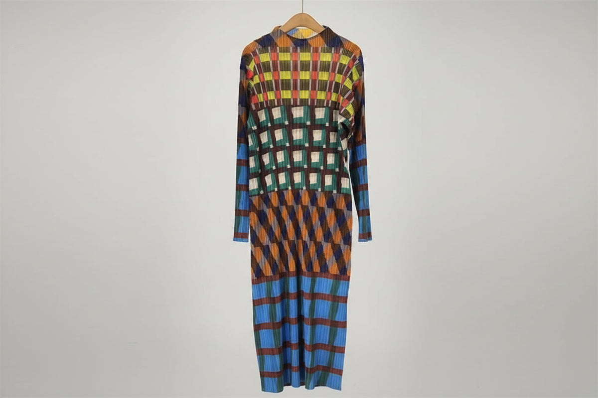 Colorful checkered dress on a hanger against a neutral background