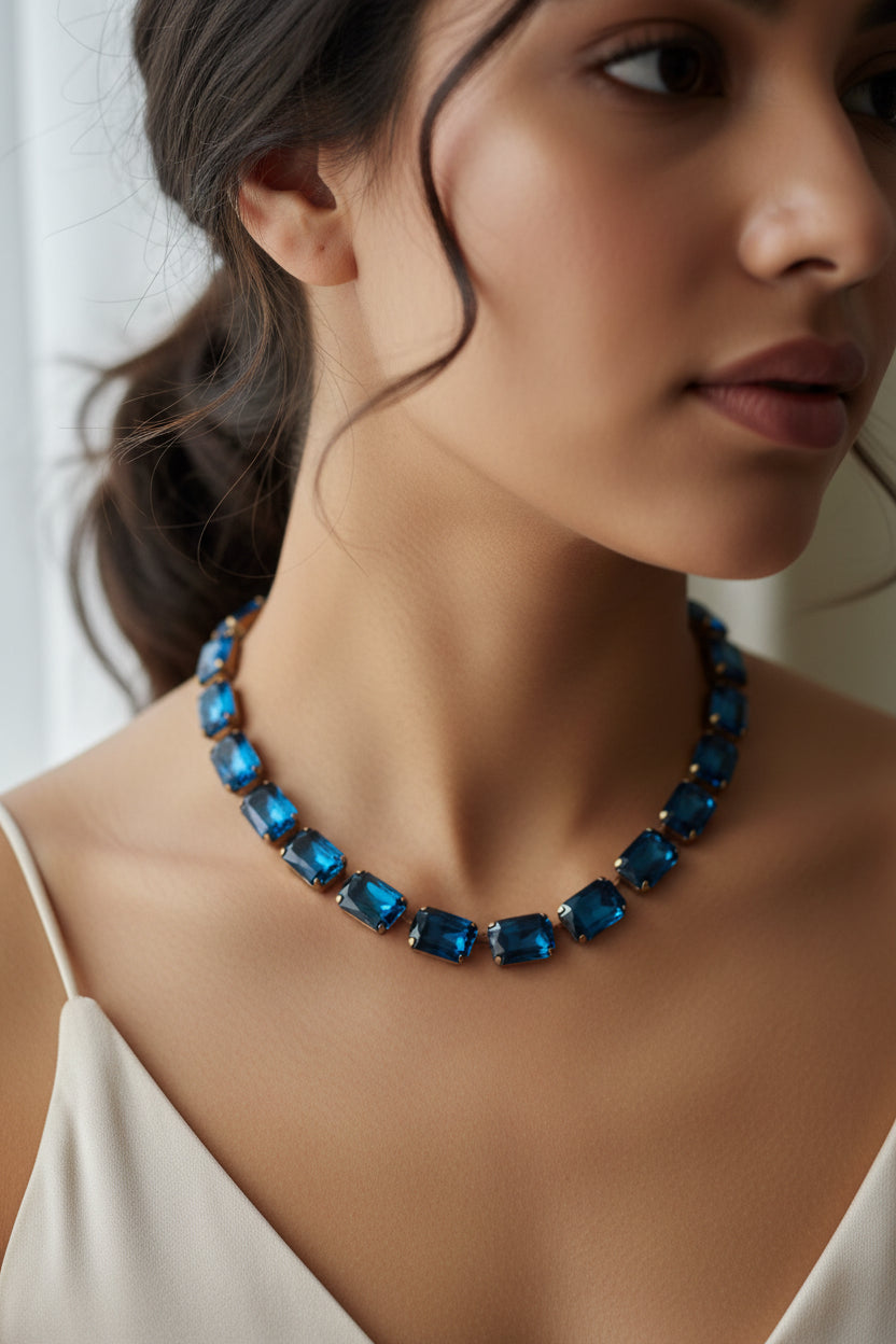 Necklace with blue square beads on a beige background