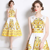 A model wearing a sleeveless, floral print, A-line midi dress with an empire waistline.