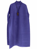 Blue sleeveless dress with a necklace on a white background