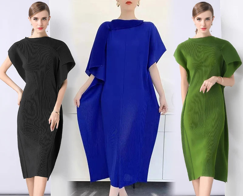 Three women wearing black, blue, and green dresses on a white background