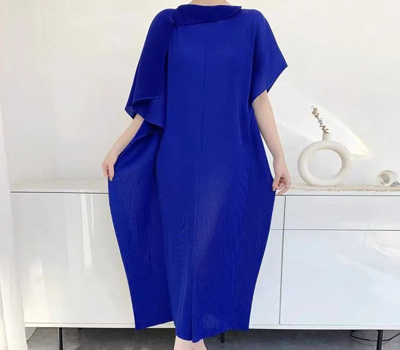 Woman wearing a blue dress against a white background