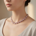 Pink beaded bracelet on a neutral background