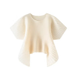 Cream-colored pleated top on a white background