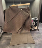 Brown ribbed sweater on a hanger with a blurred background