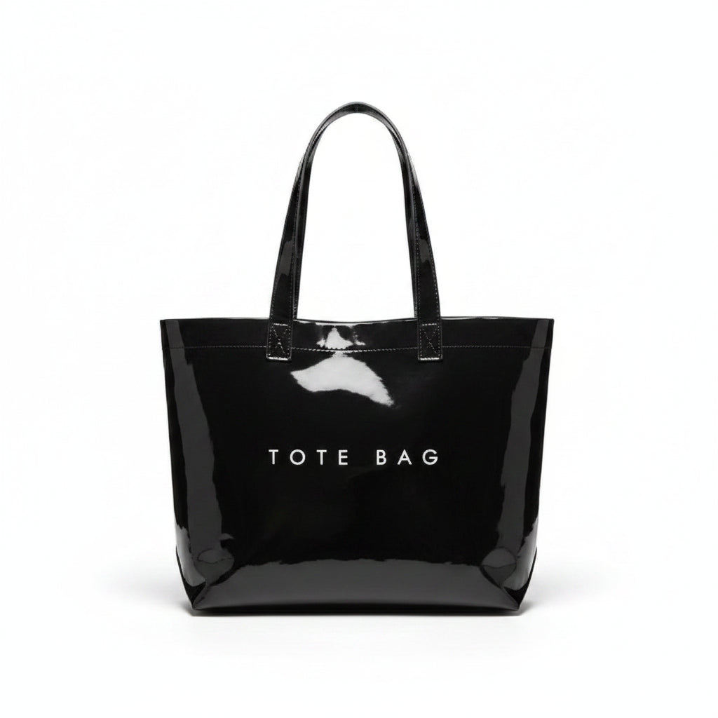 Black glossy tote bag with 'TOTE BAG' text on a light background