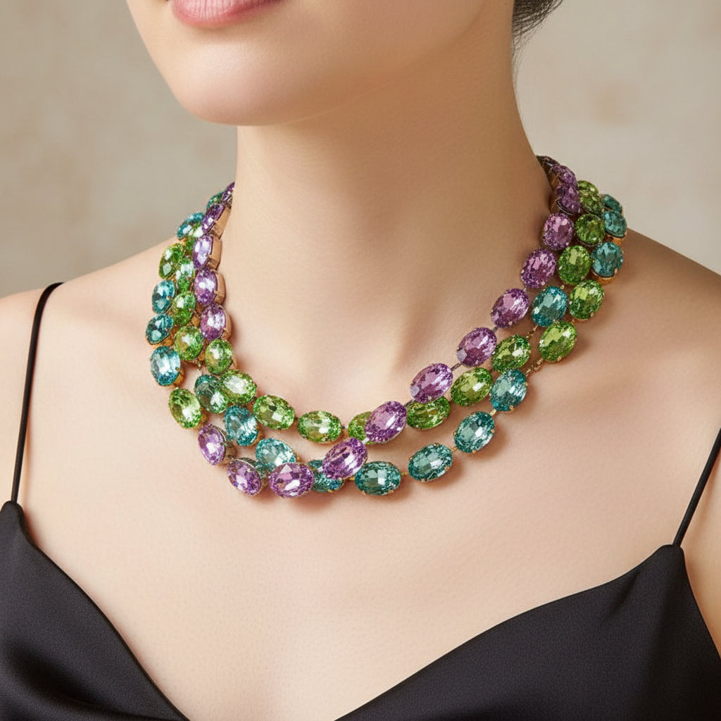 Multicolored gemstone necklace on a beige textured background